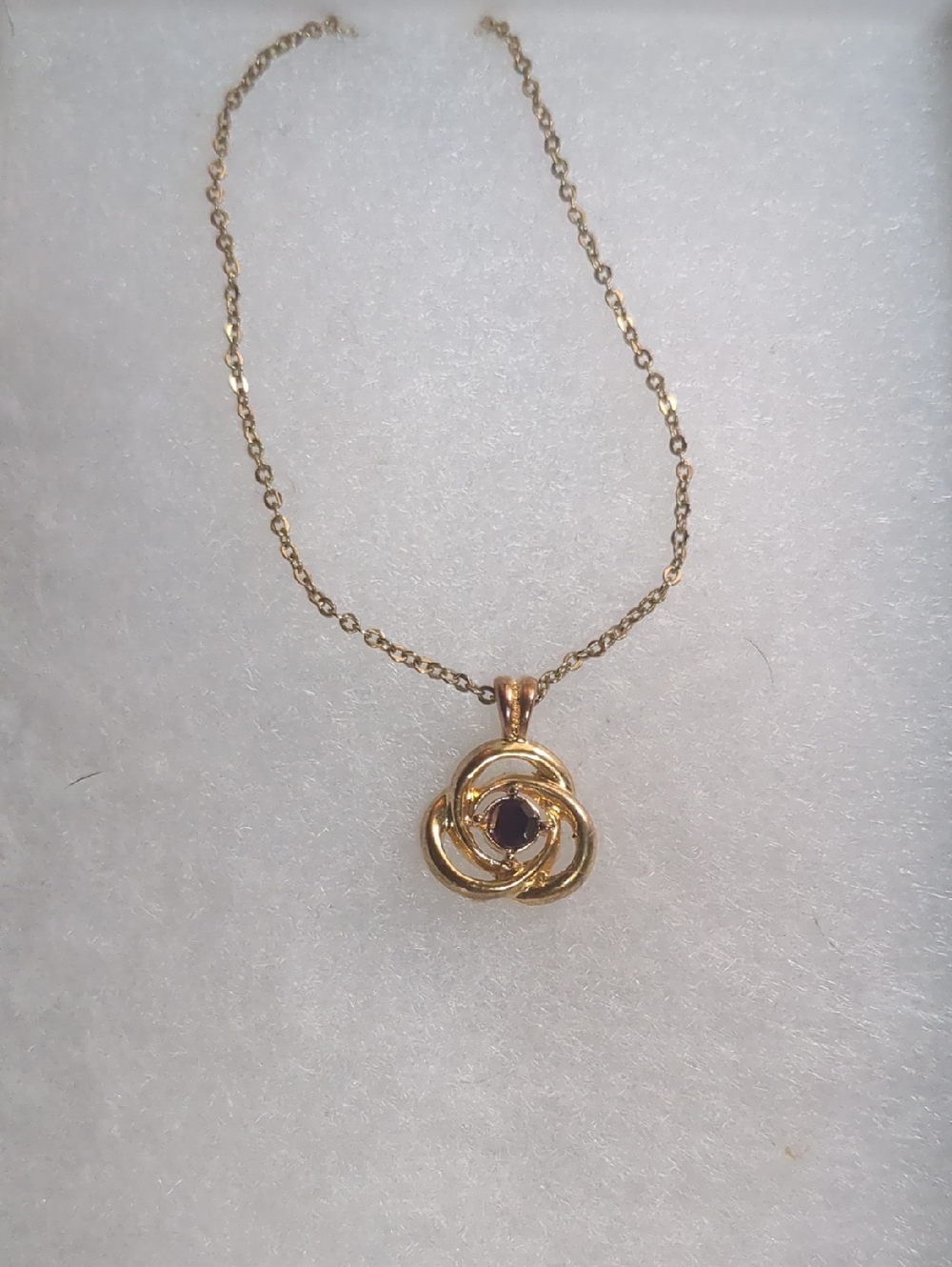 Gold Floral Knot Pendant Necklace with Dark Center Stone - Unbranded